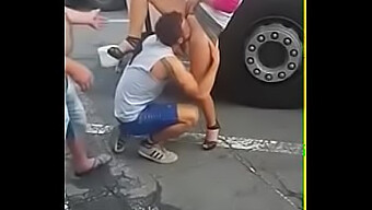 A Man Performs Oral Sex On A Woman'S Vagina In A Public Setting